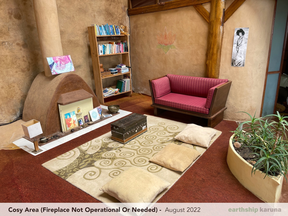 The cosy area with a decorative fireplace and hand-painted detail